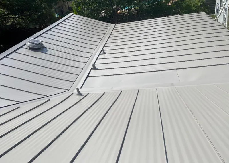 Solar attic fan installed on a metal roof for Roof Ventilation in Cameron Park